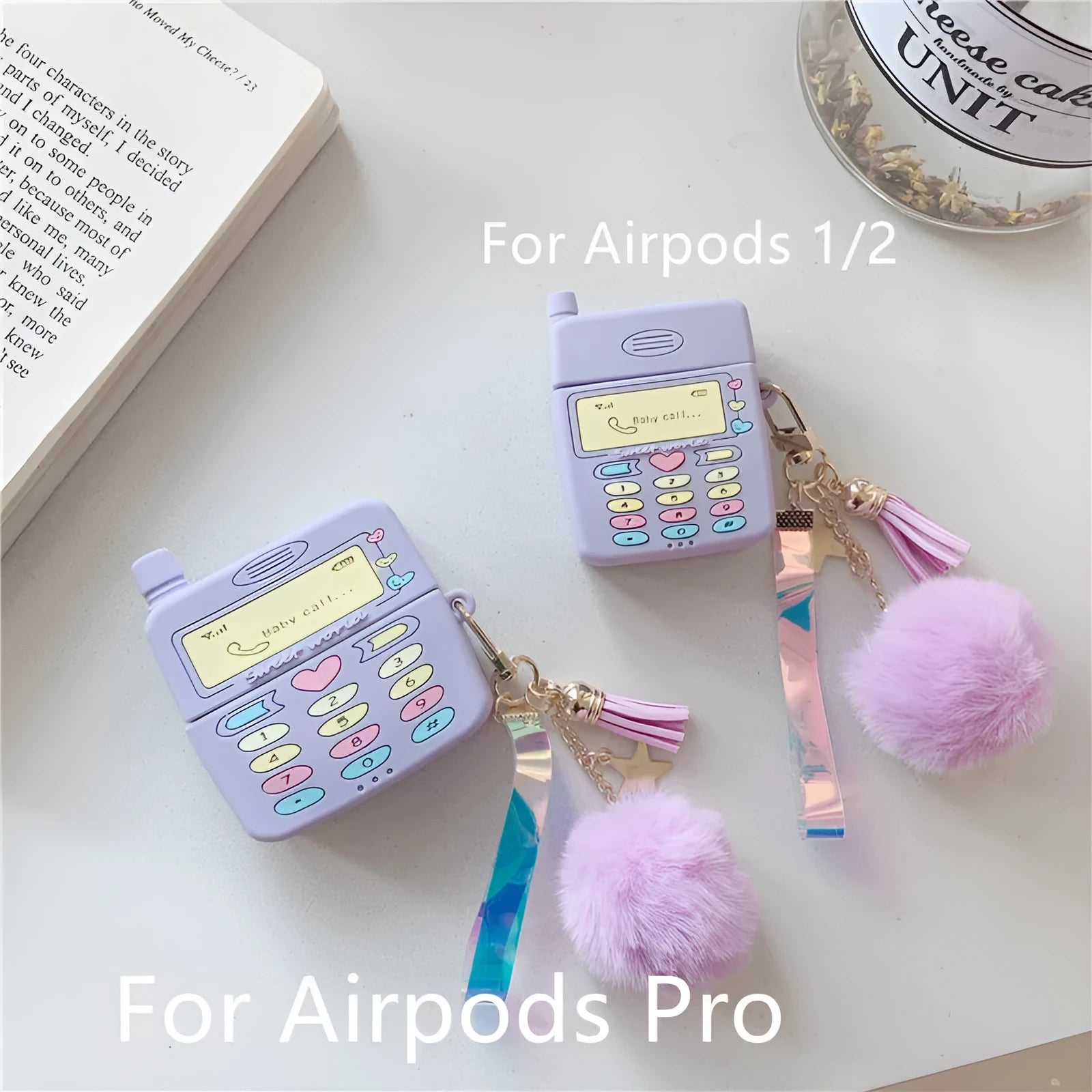 Purple silicone protective case for Apple AirPods wireless headphones with attached fur ball pendant accessory