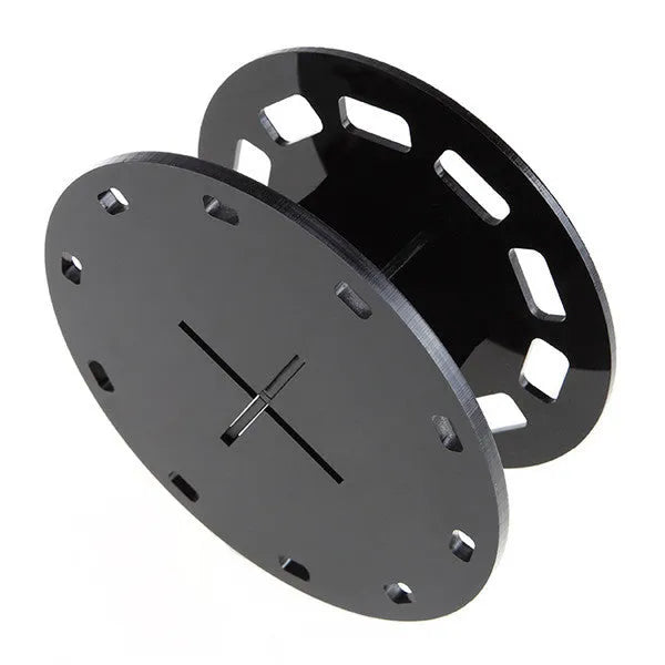 Round black plastic makeup brush holder with 10 holes for storing brushes upright on a vanity or bathroom counter