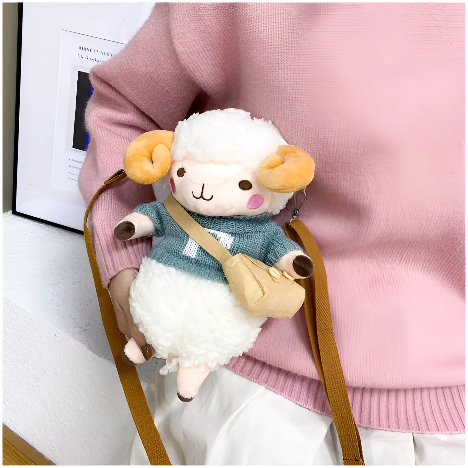 Small square blue plush crossbody bag with a white Lamb pattern and a zipper opening.