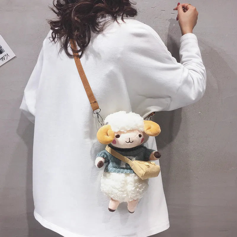 Small square blue plush crossbody bag with a white Lamb pattern and a zipper opening.