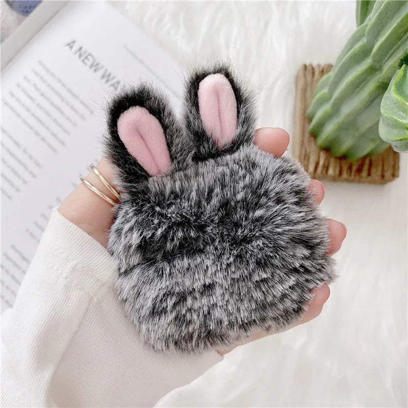 Pink and grey AirPods protective covers with rabbit ears design for Apple wireless headphones