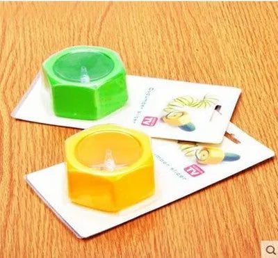 Yellow and green manual spiral vegetable cutter for slicing cucumbers, made from food-grade ABS plastic.