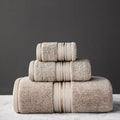 Cotton three-piece towel set with 70x150cm bath towel, 34x75cm towel, and 34x35cm square scarf in assorted colours.