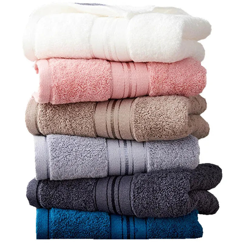 Cotton three-piece towel set with 70x150cm bath towel, 34x75cm towel, and 34x35cm square scarf in assorted colours.