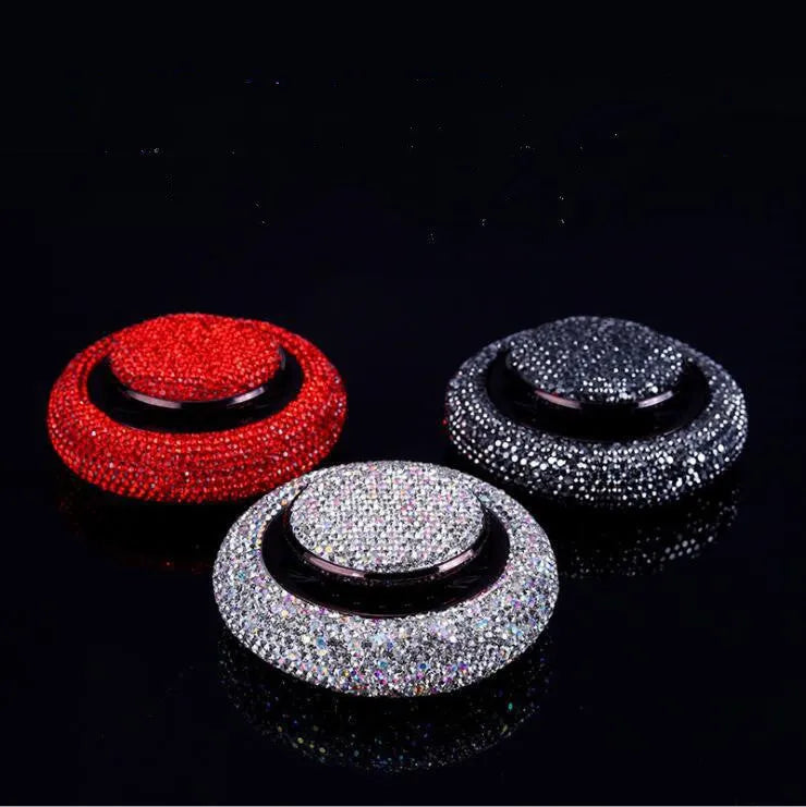 Flying saucer car perfume with electroplated alloy body and crystal drill in white, red, or black grey.