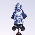 Camouflage pet coat on a small dog, hooded design in green pattern, autumn winter outdoor wear