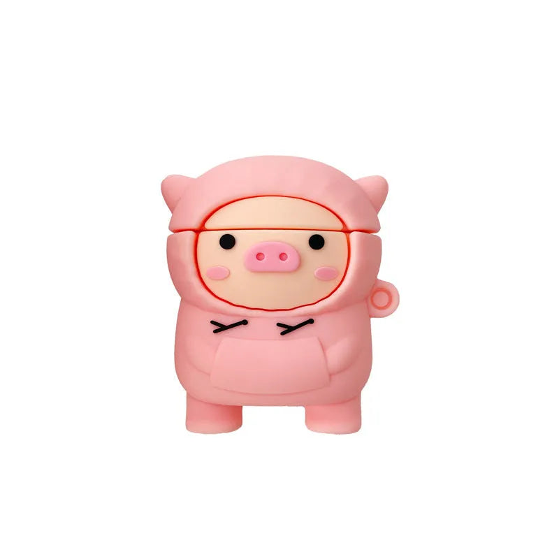 Pink silicone AirPods case with cartoon pig in sweater design, shown with flip lid open and a matching metal hook.