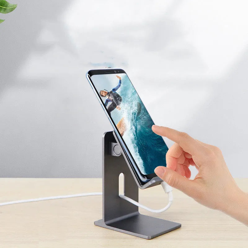 Alloy universal mobile phone holder stand in dark grey or silver on a desktop