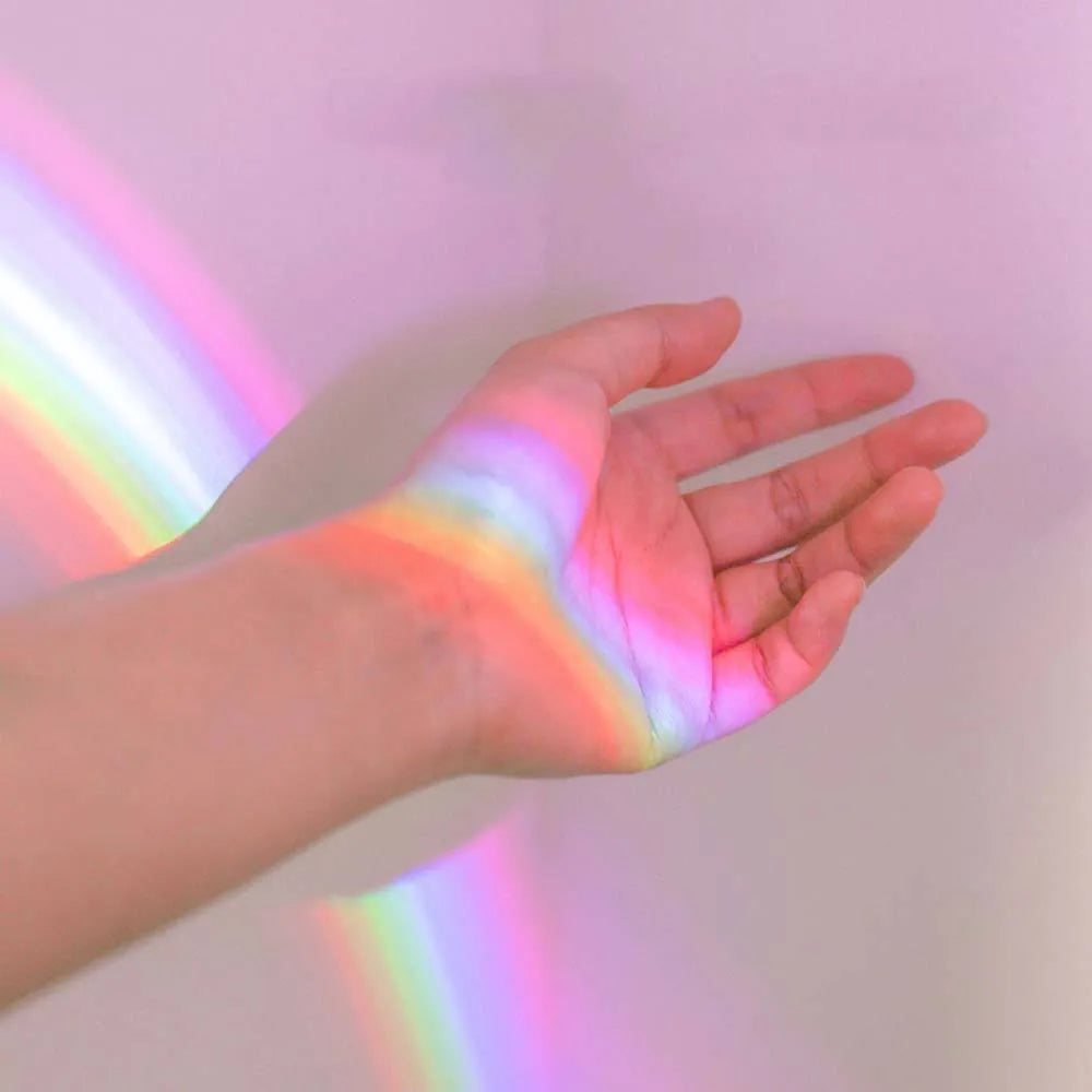 White egg-shaped LED table lamp, 14 x 10 x 6cm, projecting a rainbow onto a wall, USB rechargeable night light