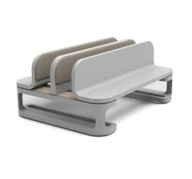 Aluminium alloy notebook vertical stand in gray with an Apple MacBook inserted in a desk setup