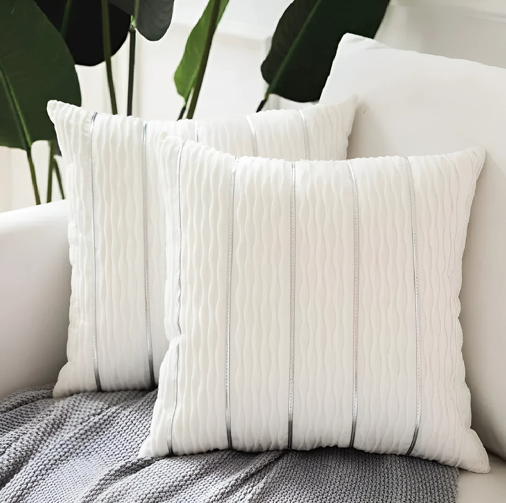 Square 45cm plush velvet pillow cover in wine red colour on a sofa.