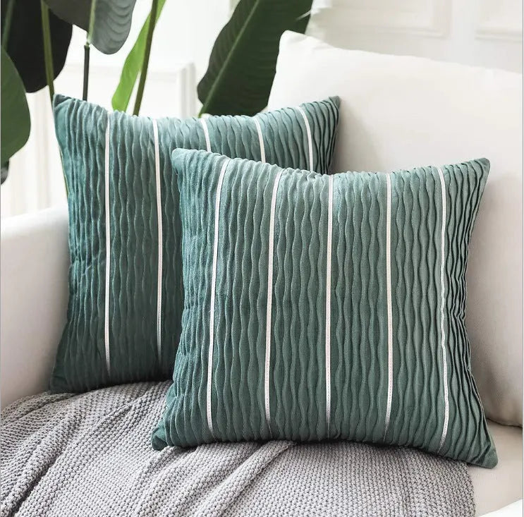 Square 45cm plush velvet pillow cover in wine red colour on a sofa.