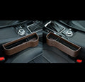 Car storage box in leather and plastic, shown in beige, black, brown, or red with left, right, or one pair options