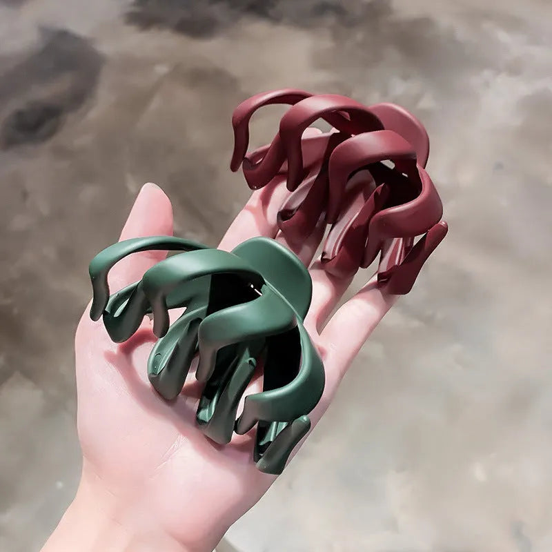 Children's hair clips in small and large sizes with green, dark blue, wine red, black, dark pink, and blue grey colour options