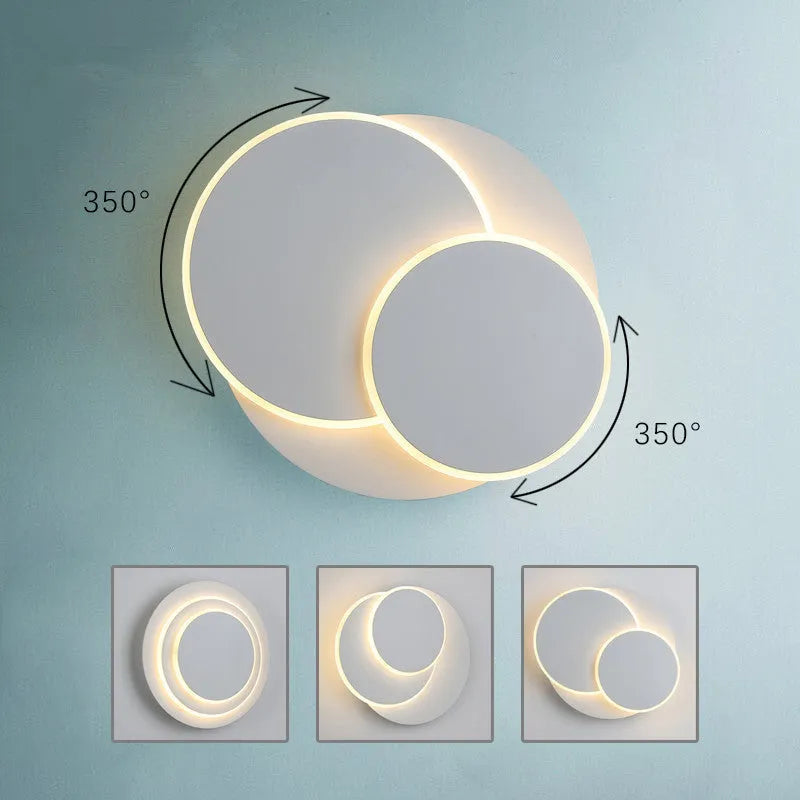 Modern round wall lamp with acrylic shade in black or white colour options