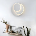 Modern round wall lamp with acrylic shade in black or white colour options