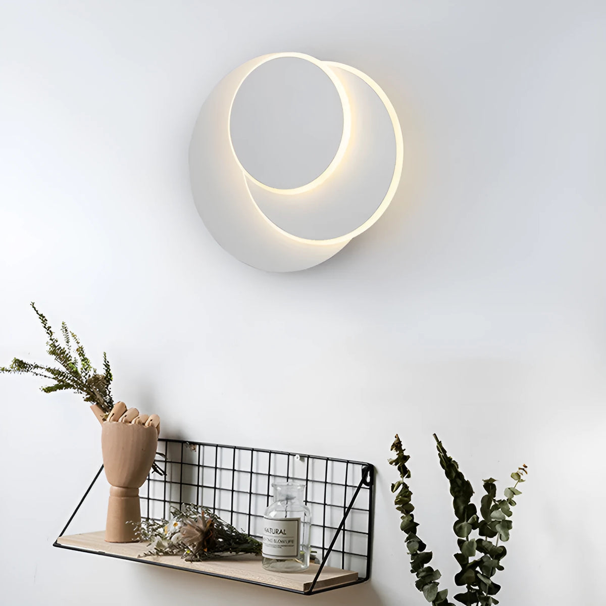 Modern round wall lamp with acrylic shade in black or white colour options