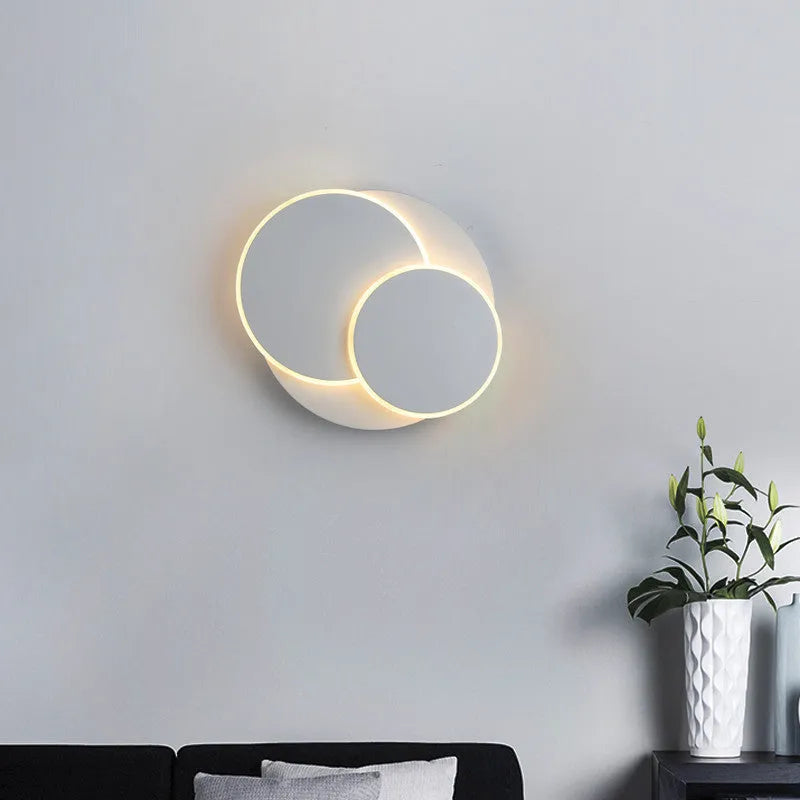 Modern round wall lamp with acrylic shade in black or white colour options