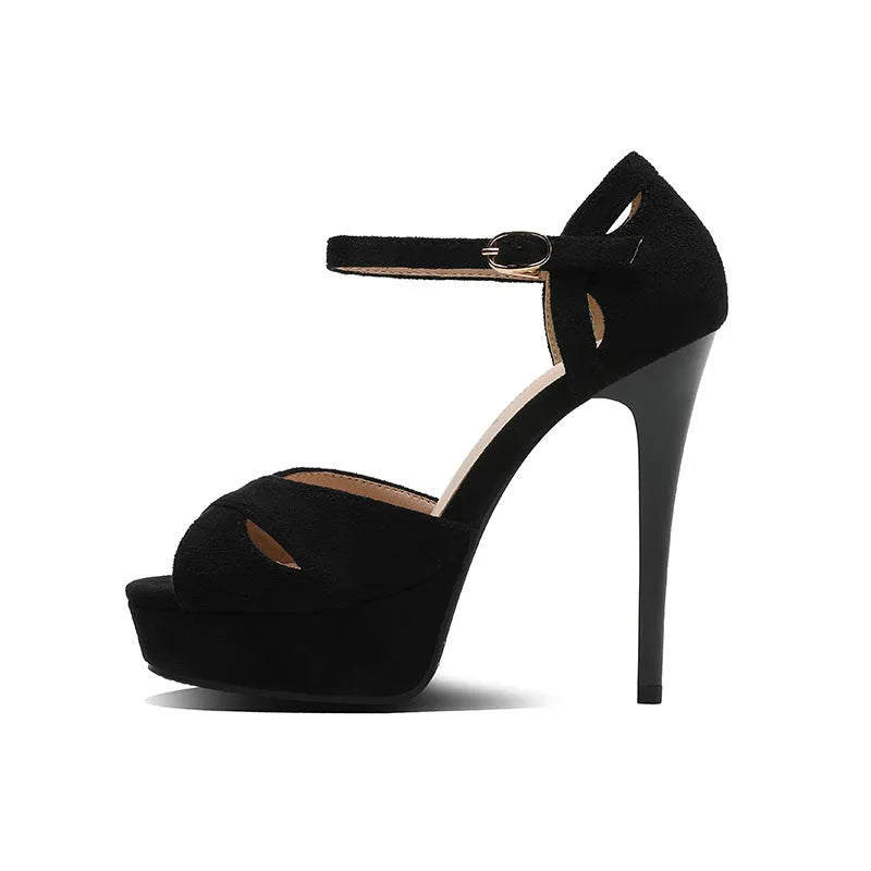 Black women's stiletto platform sandals with a fish mouth toe and Roman style design.