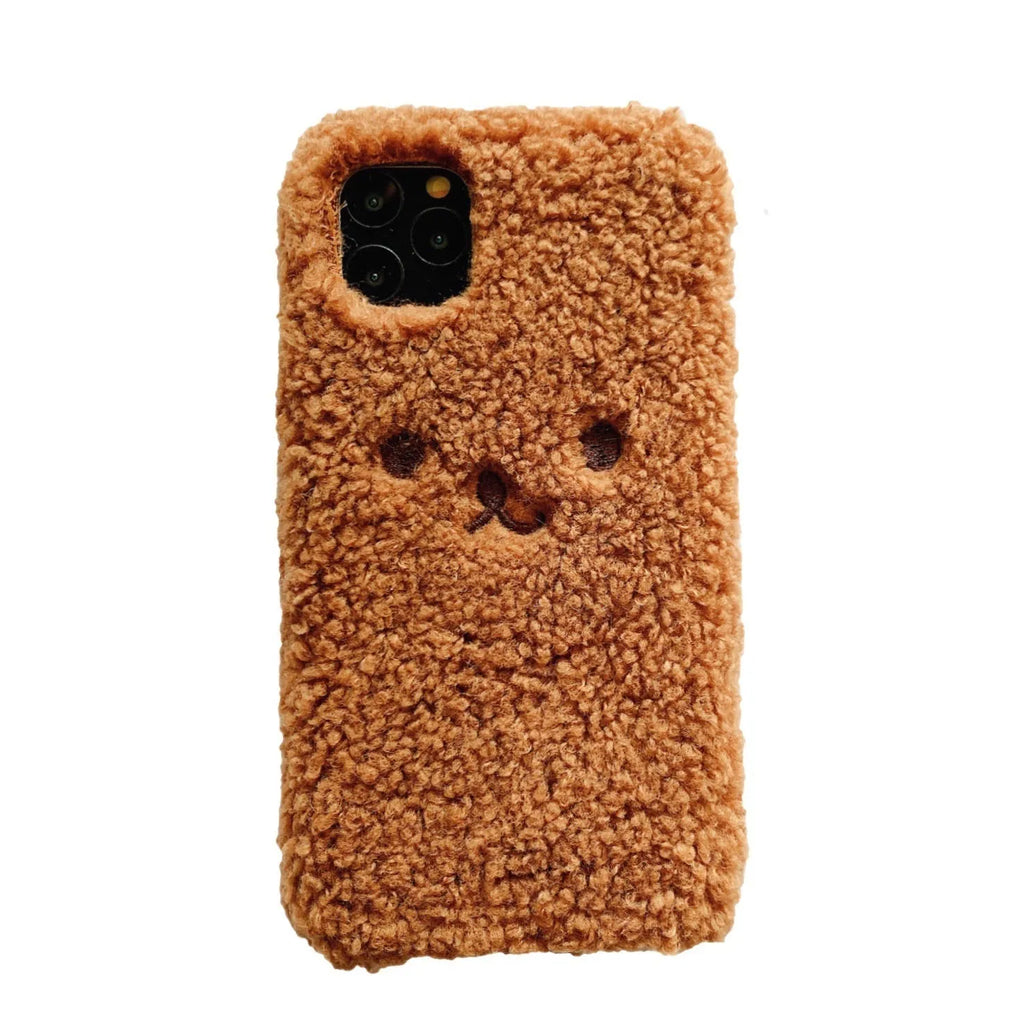 Brown embroidered plush cartoon bear face on a flexible TPU iPhone phone case.