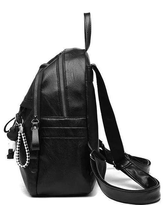 Medium black PU leather backpack with double straps showing internal organisation and waterproof features