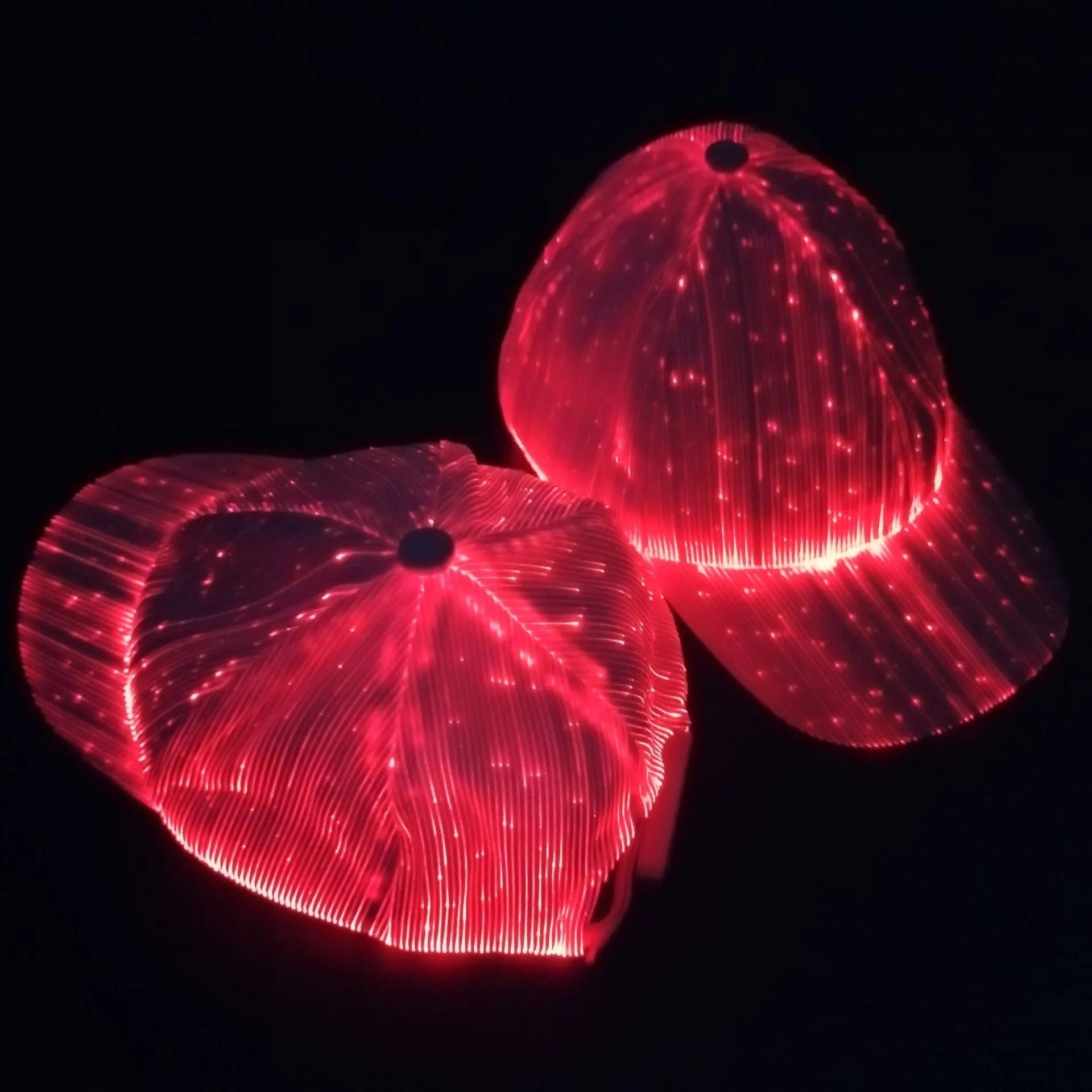 White fibre optic luminous baseball cap with LED glow on dark background