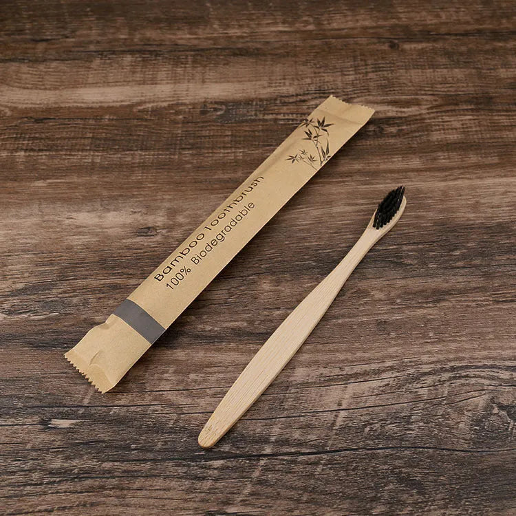 10 bamboo toothbrushes with coloured handles and charcoal bristles displayed together