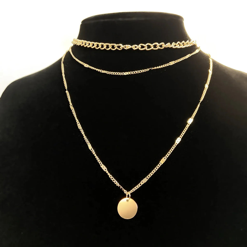 Women's multilayer necklace with disc pendant and clavicle chain in gold or silver electroplated alloy