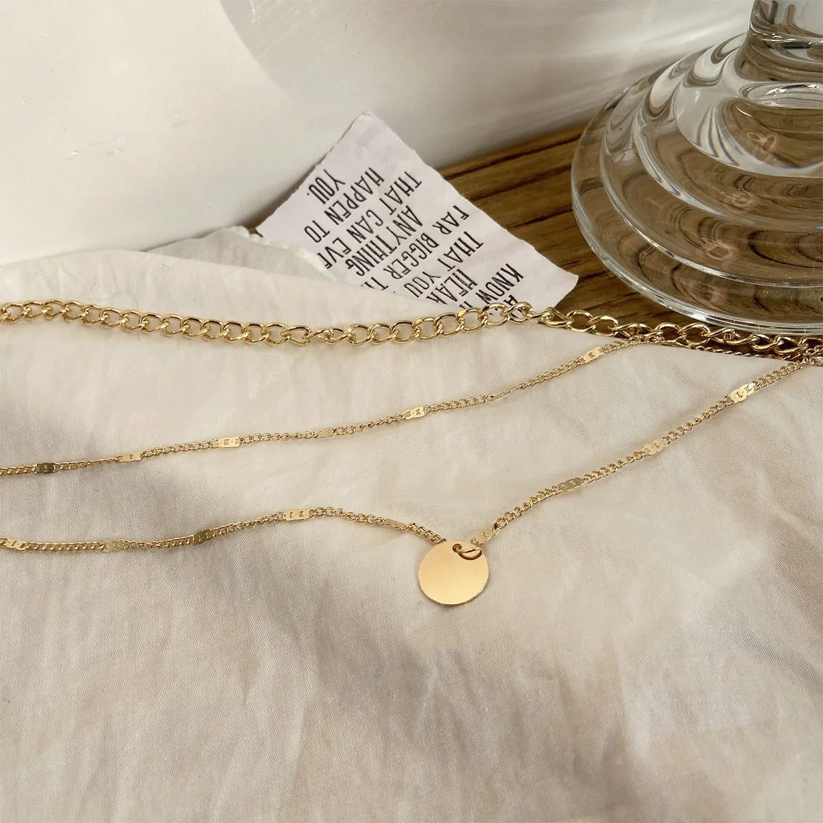 Women's multilayer necklace with disc pendant and clavicle chain in gold or silver electroplated alloy