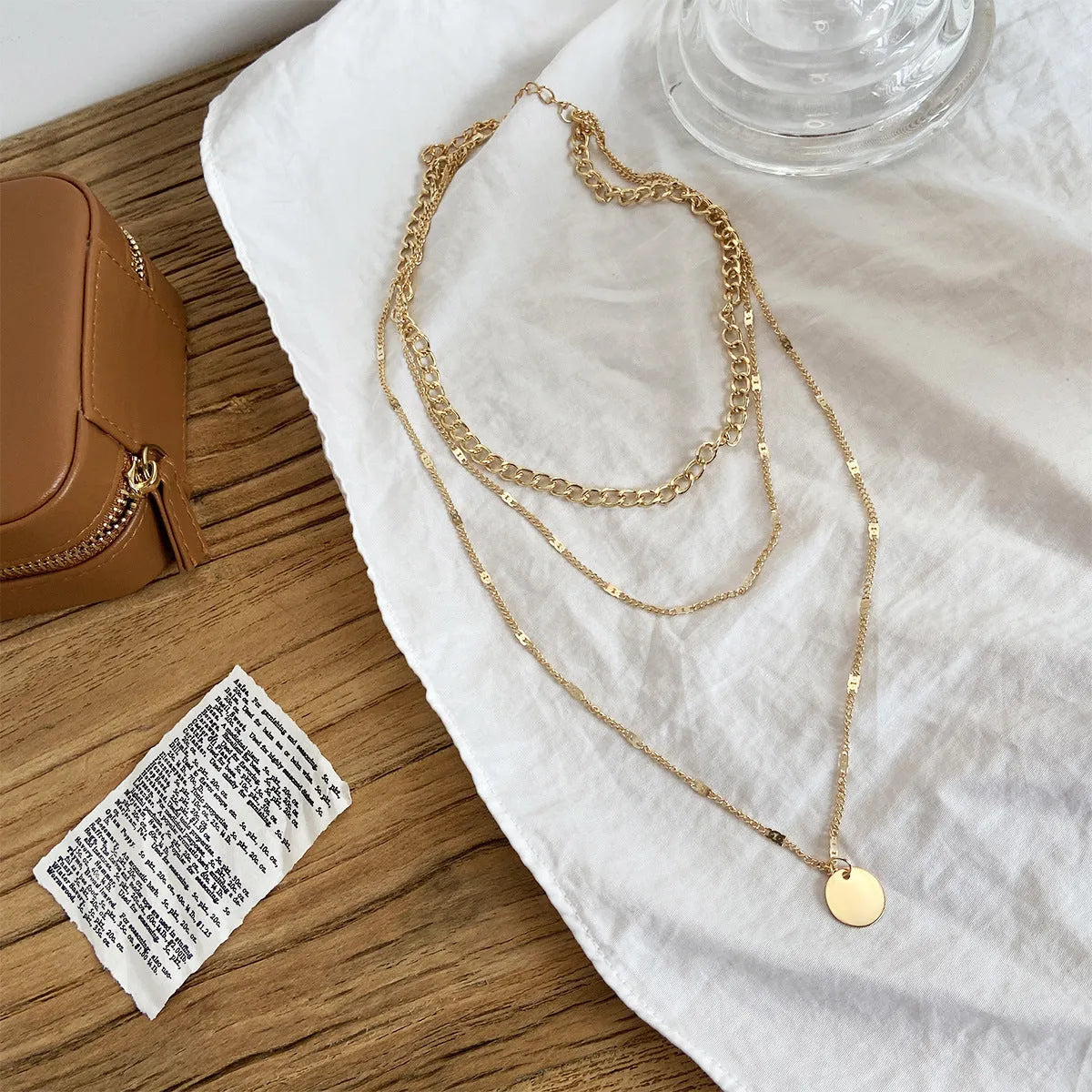 Women's multilayer necklace with disc pendant and clavicle chain in gold or silver electroplated alloy