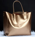 Cowhide leather women's handbag with adjustable strap in multiple colours showing dimensions