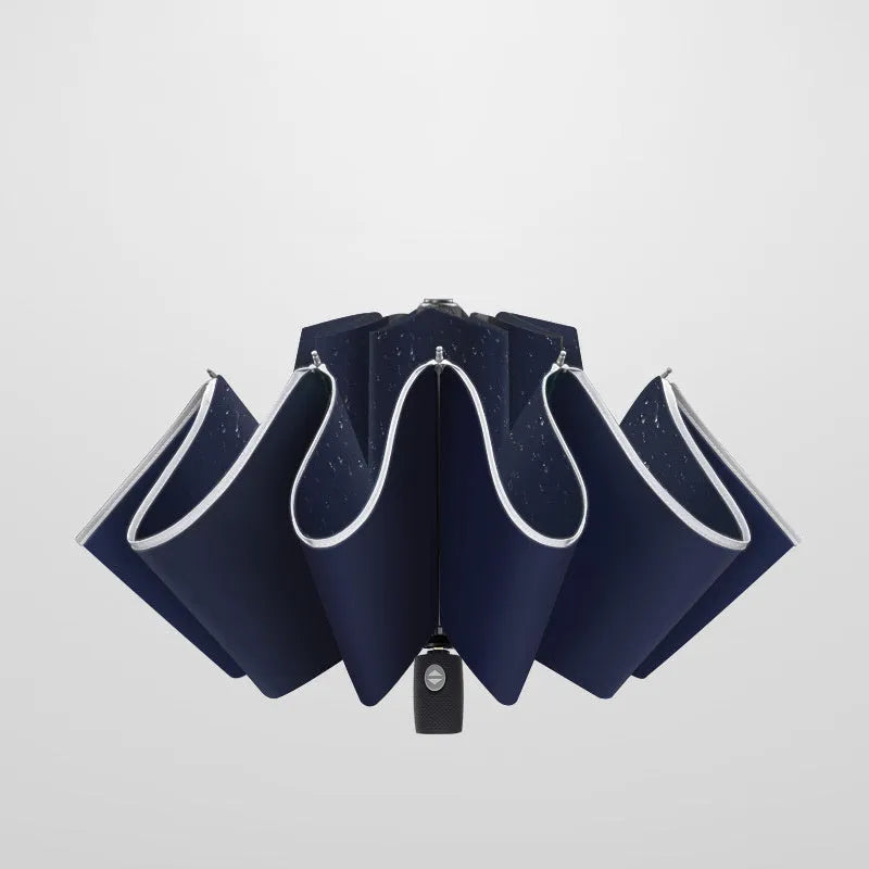Automatic reverse umbrella showing three-fold design and plastic non-slip handle