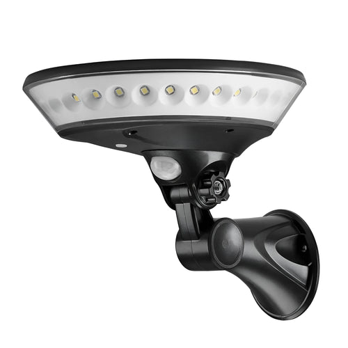 White 360-degree solar-powered outdoor light with motion sensor on a stake for garden installation.