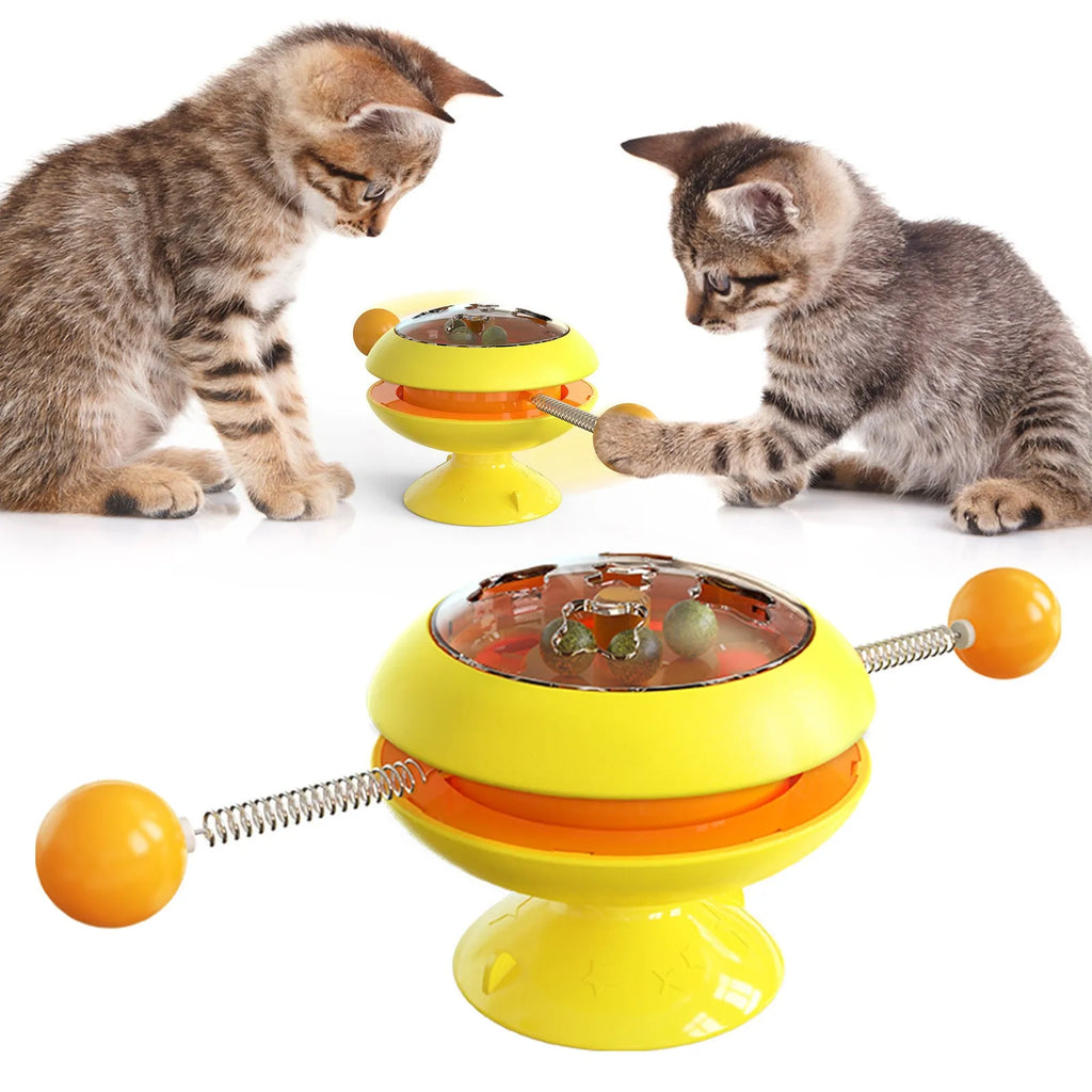Rotating interactive cat toy with catnip balls in a clear top and a large suction cup base, in lake blue colour.