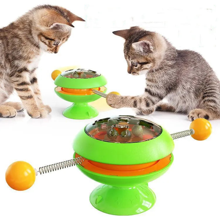 Rotating interactive cat toy with catnip balls in a clear top and a large suction cup base, in lake blue colour.