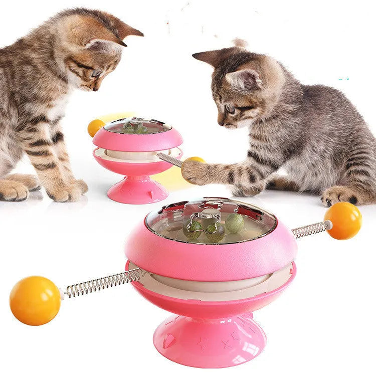 Rotating interactive cat toy with catnip balls in a clear top and a large suction cup base, in lake blue colour.