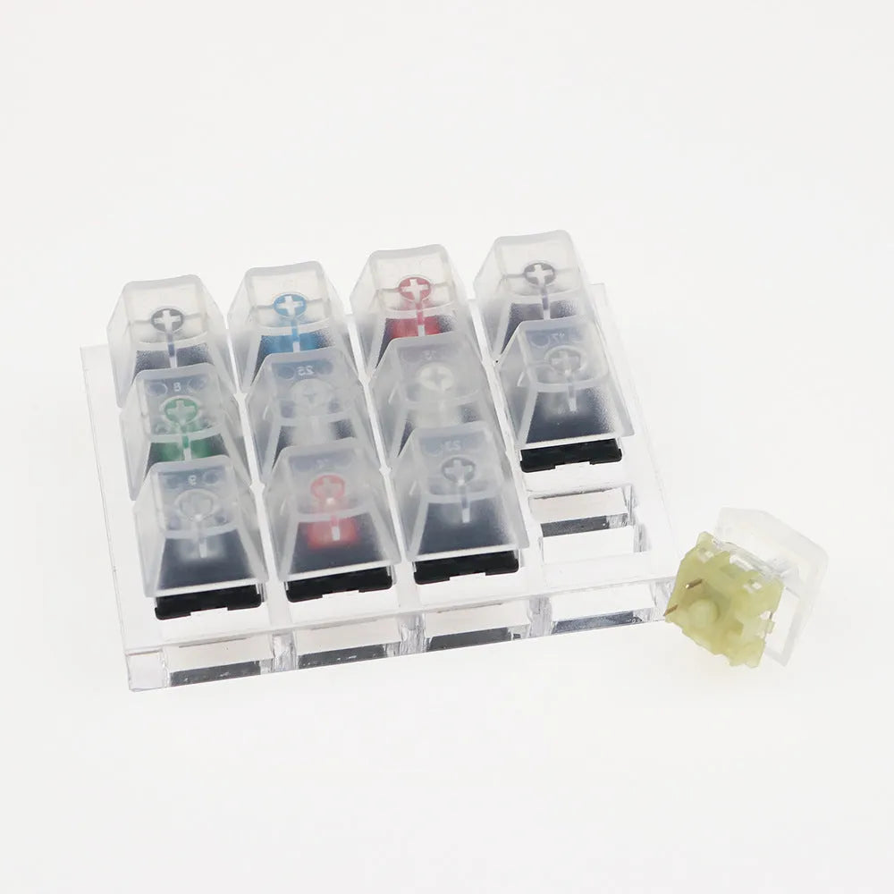 Cherry twelve-axis switch tester with white housing showing black green black tea and milk green switches