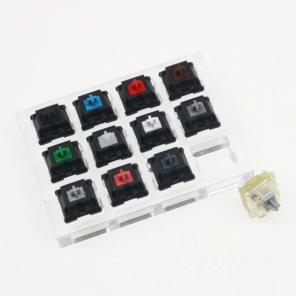 Cherry twelve-axis switch tester with white housing showing black green black tea and milk green switches