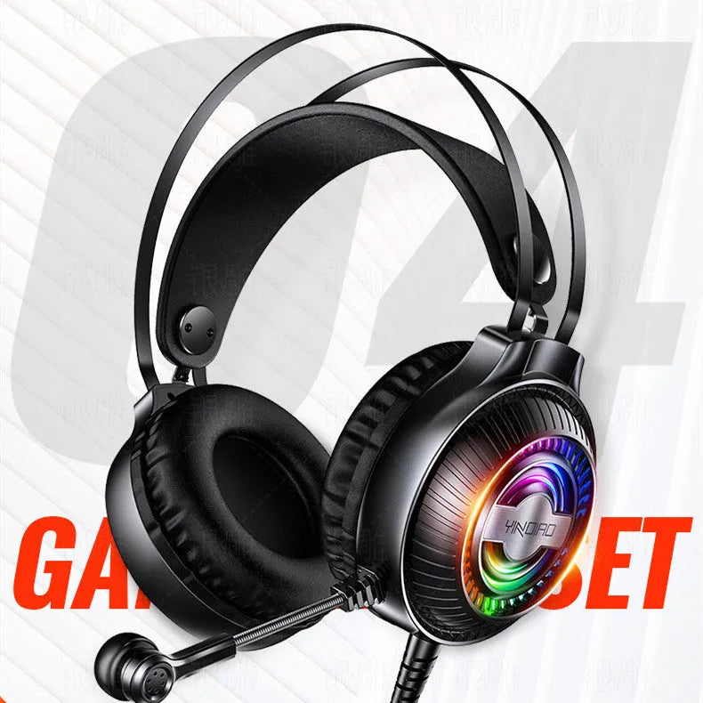 Black and white wired over-ear PC gaming headset with microphone on a desk.