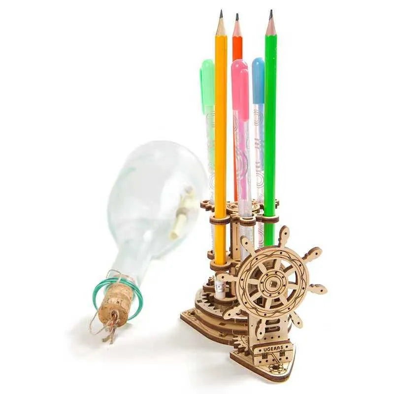 Ukrainian wooden rotating pen holder model with visible gears on a desk.