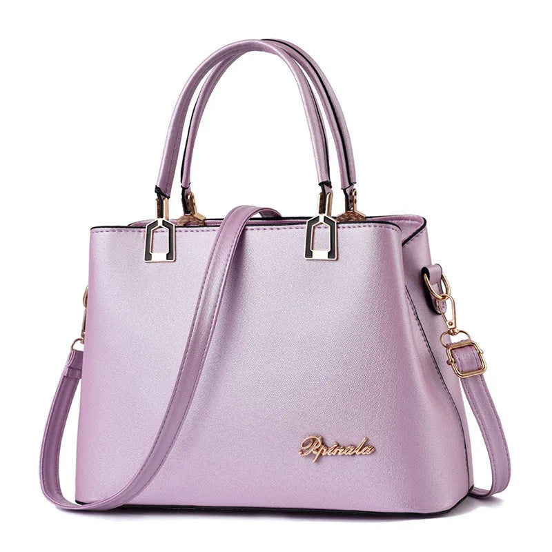 Ladies PU leather handbag with zip closure, horizontal square shape, car suture detail, and single handle