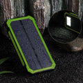 Orange solar power bank showing multiple USB ports and displaying 20000 mAh capacity