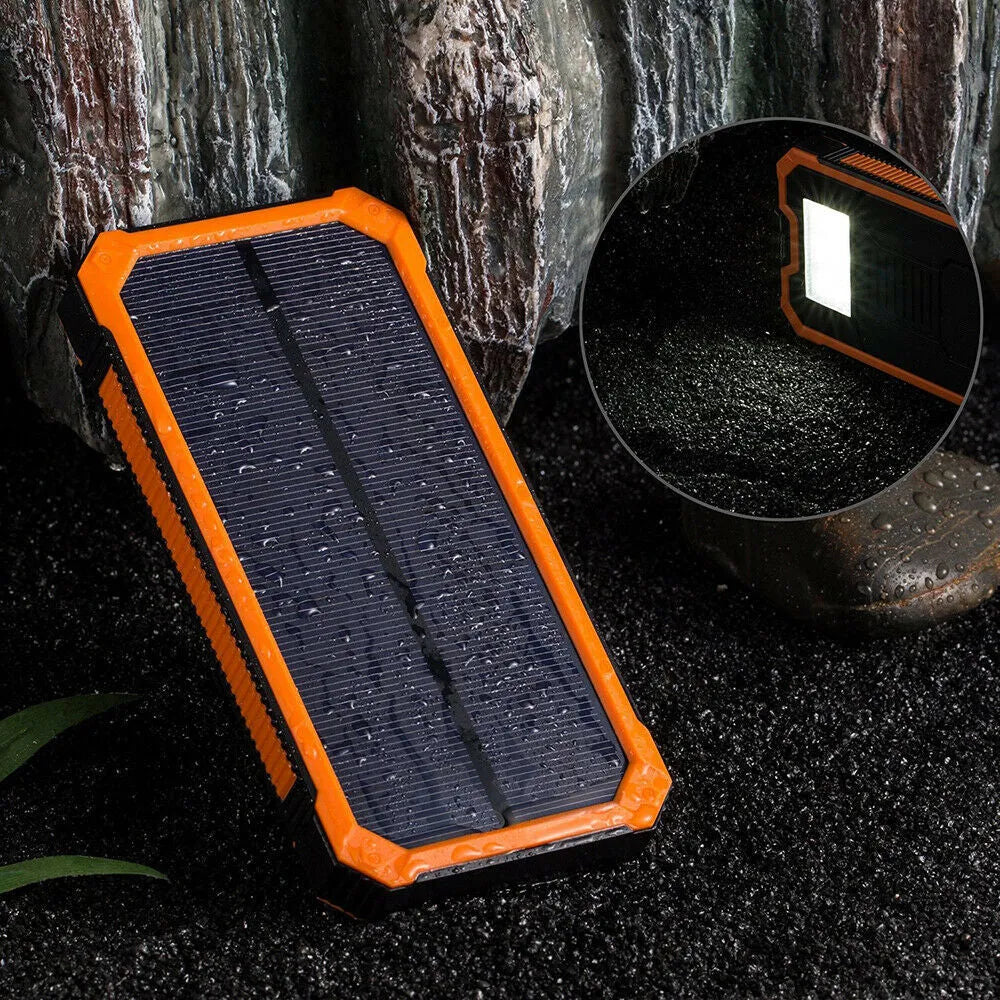 Orange solar power bank showing multiple USB ports and displaying 20000 mAh capacity