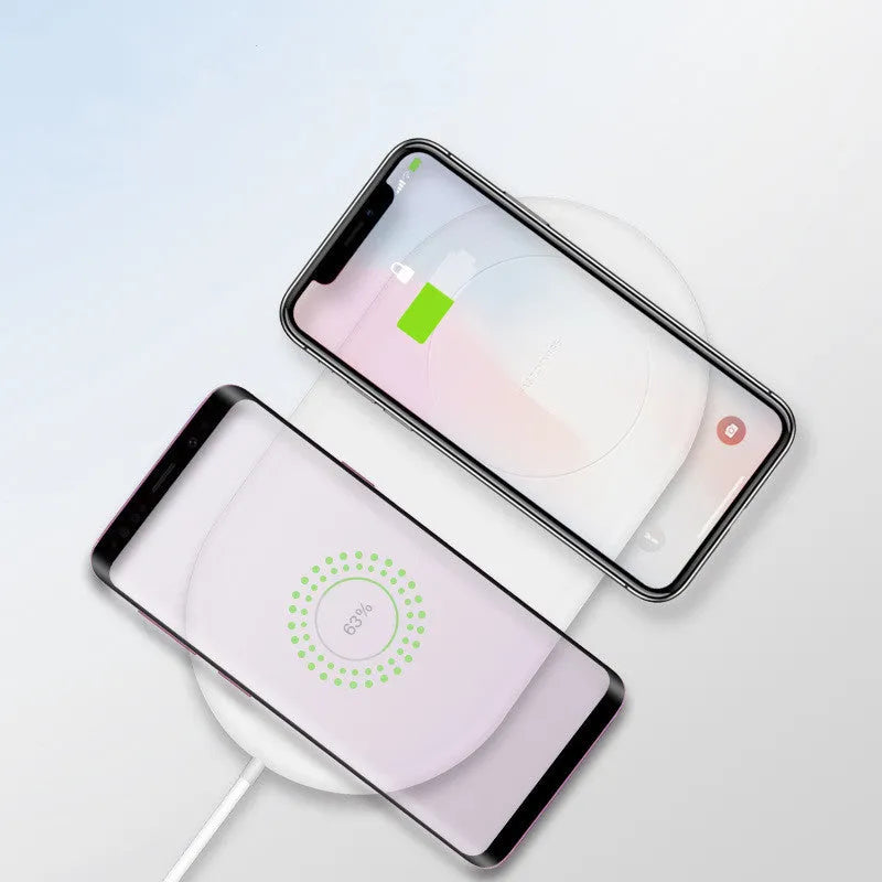 White dual-charge wireless charger for two mobile phones with fast charging capability