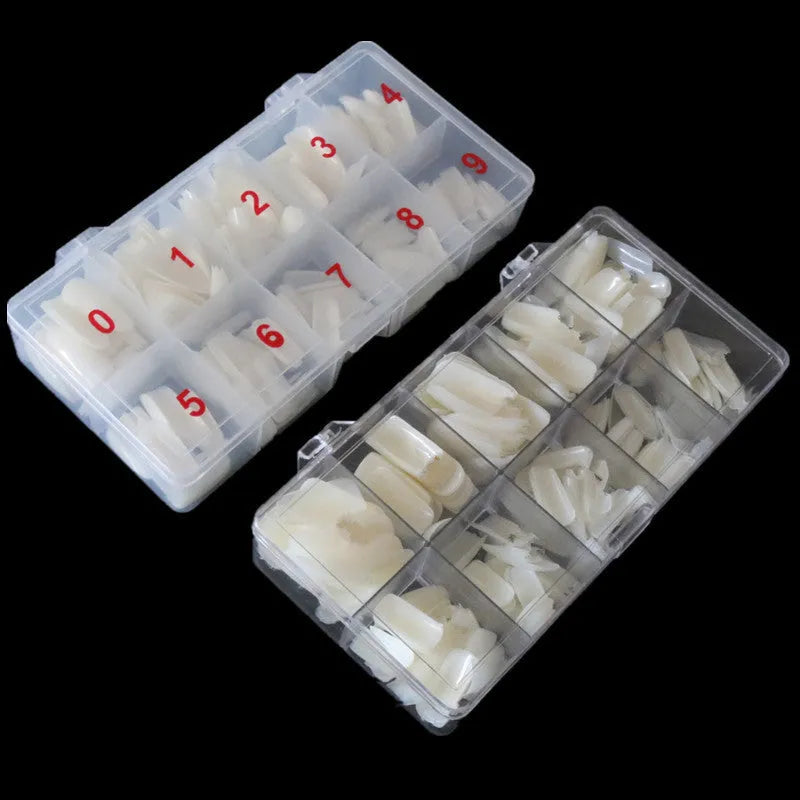Box of 500 nail armour pieces in transparent, natural colour, and white finishes for home or salon use.