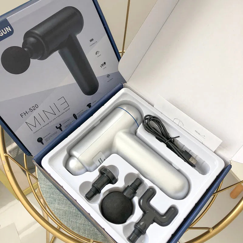 Cordless fascia massage gun with USB charging port in grey, red, or black colour options
