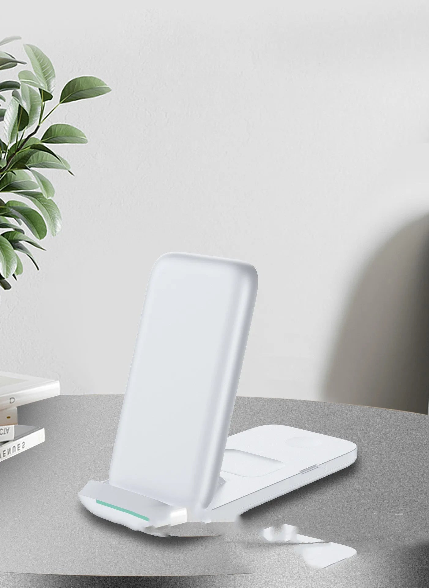 Black and white foldable three-in-one wireless charger for phone, smartwatch, and earbuds.