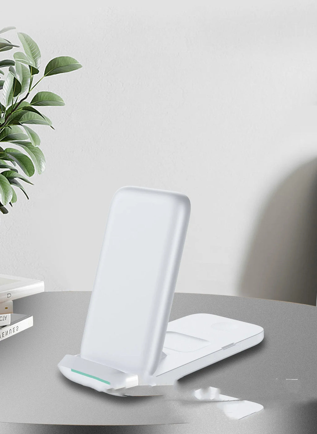Black and white foldable three-in-one wireless charger for phone, smartwatch, and earbuds.