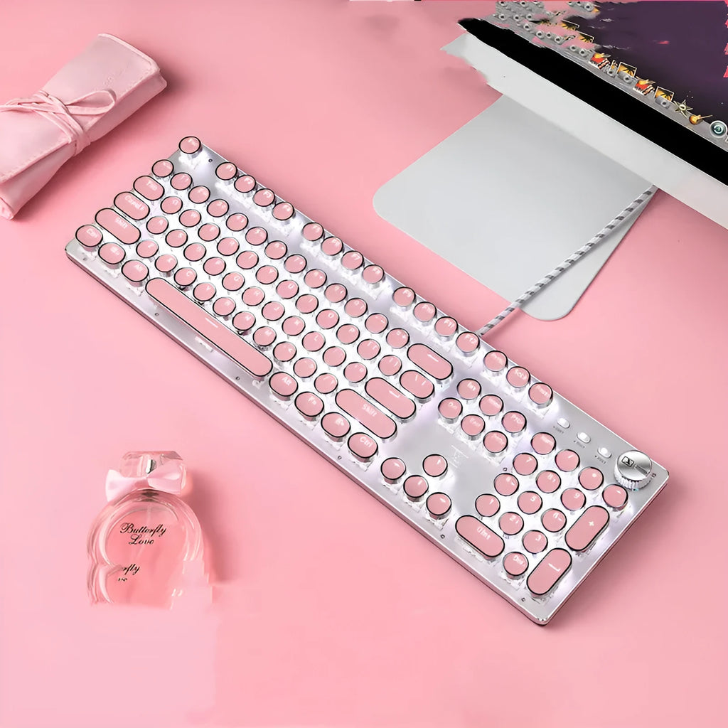 Wired mechanical keyboard with green switches round keys silver base pink colour USB connection