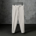 Men's straight loose trousers in light gray brushed polyester, front view showing straight cut and elastic waist